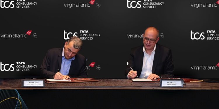 (L-R) Amit Kapur, Country Head - UK & Ireland, TCS; Shai Weiss, CEO - Virgin Atlantic Signing the Partnership Document